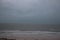 Storm on the beach. The seas are raging and the skies show the tropical storm as the power of nature is demonstrated. palm tree pu