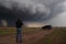 storm chaser capturing dramatic tornado footage with drone