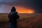 storm chaser in extreme weather conditions, with lightning and rain visible