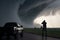 storm chaser filming tornado from the safety of their vehicle