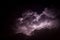 Storm Cloud Lit Up by Lightning at Night