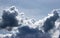 Storm clouds on the blue sky. Background. Cumulus epic scenic storm clouds in the blue sky background texture