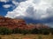 Storm clouds build behind the Sedona red rocks