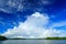 Storm clouds with dark blue sky. Bentota Ganga river, Sri Lanka. Summer landscape with white stormy clouds. Mangrove trees in the