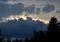 Storm clouds of fluffy puffy shape the beginning of a bubble-shaped thunderstorm, steel-gray color thunderstorm cell in the sky. h