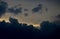 Storm clouds of fluffy puffy shape the beginning of a bubble-shaped thunderstorm, steel-gray color thunderstorm cell in the sky. h