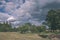 storm clouds forming over the countryside - vintage retro look