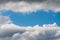 Storm clouds forming space for blue sky