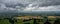 Storm clouds gather over the Severn Valley as viewed from Coaley Peak, Gloucestershire, England