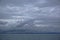 Storm clouds gathering over the deep blue waters of the Gulf of Alaska