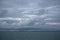 Storm clouds gathering over the deep blue waters of the Gulf of Alaska