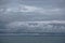 Storm clouds gathering over the deep blue waters of the Gulf of Alaska