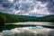 Storm clouds and mountains reflecting in Unicoi Lake, at Unicoi