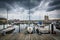 Storm clouds over docks and boats in Harbor East, Baltimore, Mar