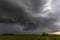 Storm clouds over field, tornadic supercell, extreme weather, dangerous storm