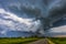 Storm clouds over field, tornadic supercell, extreme weather, dangerous storm