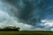 Storm clouds over field, tornadic supercell, extreme weather, dangerous storm