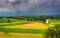 Storm clouds over fields and distant mountains seen from Longstreet Observation Tower in Gettysburg, Pennsylvania.