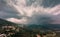 Storm clouds over the mountain village of Belgodere in Corsica