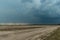 Storm clouds over the vast plain.