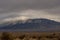 Storm clouds rolling in over the Sandia Mountains in Albuquerque New Mexico