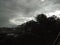 Storm clouds seen through rain drops on a window