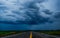 Storm clouds sky background over the highway in countryside landscape of Thailand.