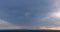 Storm clouds at sundown during sunset in a dramatic panorama