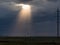 Storm clouds and sunlight. Sunlight breaks through the clouds.