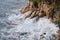 Storm on the croatian beach with waves crushing on cliffs.