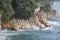 Storm on the croatian beach with waves crushing on cliffs.