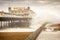 Storm Desmond waves crashing under pier.