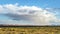 Storm Monument Valley, August 8, 2017. Isolated rainstorm at the Monument Valley with sunshining surround it and sunny mountains o