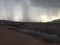 A storm moving across a campground in the desert