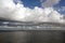 Before the storm. A painted view of storm and rain clouds and the sky above the sea horizon.