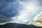 Storm and rain cloud moving past the mountain