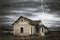 Storm with rain and a thunderbolt over a scary old abandoned house