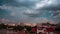 Storm rainy dramatic clouds moving fast over a residential area in city