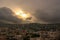 A storm is rising over Bethlehem, Palestine, with the sun breaking briefly through the clouds over the conflict riddled town
