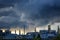 Storm rolls in over industrial site