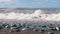 Storm on the Sea. Bottom view of the Stony Shore. Huge Waves are Crashing on the Beach