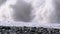 Storm on the Sea. Bottom view of the Stony Shore. Huge Waves are Crashing on the Beach