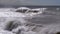 Storm on the Sea. Huge Waves are Crashing and Spraying on the Shore. Slow Motion