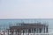 Storm on the sea, waves of foam against the background of the beach pier, Alanya, December 2023.