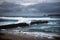 Storm Seas smashing into the harbour wall at Sennen Cove Cornwall UK