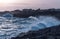 storm seascape at dusk. sunset sea over cliff and rocks. Taranto coastline