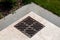 Storm shower iron grate on a marble pavement.