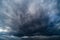 storm sky, dark dramatic clouds during thunderstorm, rain and wind, extreme weather, abstract background