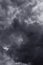Storm sky with dark gray black epic clouds background texture, hurricane with thunderstorm, cyclone. Black and white