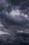 Storm sky with dark grey black epic clouds background texture, hurricane with thunderstorm, cyclone